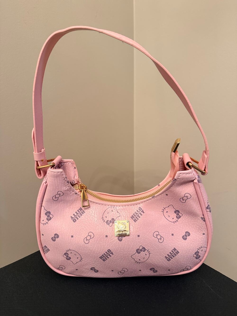 Hello Kitty Pink monogram crescent shoulder bag, all-over character print.